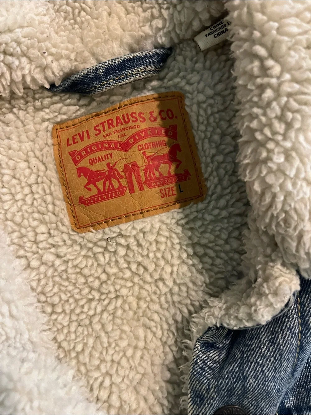 Levi's Light Blue Denim Trucker Jacket with Cream Sherpa Lining